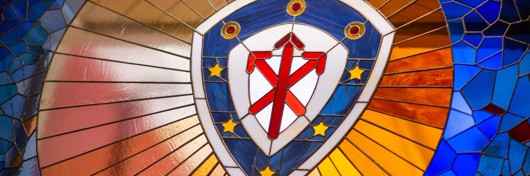 College of Arts and Sciences shield design in stained glass